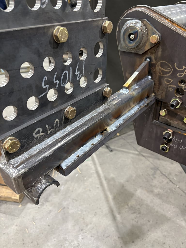 Close-up of vintage radio or electronic equipment with metal panel, brass knobs, and numbered dials showing signs of wear and age
